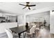 Bright dining area featuring modern table and chairs, open to the living area and kitchen at 608 Pearl Rd, Winter Springs, FL 32708
