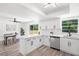 Open concept kitchen and dining area featuring white cabinets and stainless steel appliances at 608 Pearl Rd, Winter Springs, FL 32708