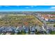 Expansive aerial view of residential homes and green spaces at 609 Big Pine Ave, Minneola, FL 34715