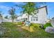 Spacious backyard with playset, privacy fence, and lush green grass at 609 Big Pine Ave, Minneola, FL 34715