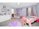 Charming bedroom with princess decor, with soft carpet and ample natural light at 609 Big Pine Ave, Minneola, FL 34715