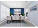 Stylish dining room featuring modern decor, chandelier, and neutral color palette at 609 Big Pine Ave, Minneola, FL 34715