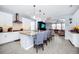 Open layout showcases the kitchen with granite countertops, bar stool seating and living room for entertaining at 609 Big Pine Ave, Minneola, FL 34715