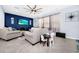 Cozy living room featuring a large sectional sofa, a ceiling fan, and a TV at 609 Big Pine Ave, Minneola, FL 34715