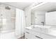 Contemporary bathroom with stylish vessel sink, marble-style tiling, and shower with glass at 6384 Raleigh St # 2214, Orlando, FL 32835