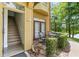 Cozy front porch with outdoor seating, perfect for enjoying the lakeside view and the surrounding green landscape at 6384 Raleigh St # 2214, Orlando, FL 32835
