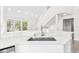 Modern kitchen boasts a stainless steel sink, stone countertops, and bright lighting for a stylish cooking space at 6384 Raleigh St # 2214, Orlando, FL 32835