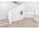 Bright living room features modern flooring and staircase at 6384 Raleigh St # 2214, Orlando, FL 32835