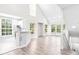 Bright and airy living room featuring high ceilings, large windows, and modern flooring, ideal for entertaining at 6384 Raleigh St # 2214, Orlando, FL 32835
