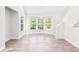 Bright living room featuring modern floors, a large bay window, and lots of natural light to provide comfort at 6384 Raleigh St # 2214, Orlando, FL 32835
