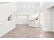 Open-concept living room with sleek floors and staircase, offering a clean and modern aesthetic for comfortable living at 6384 Raleigh St # 2214, Orlando, FL 32835
