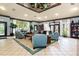 Community lounge area with comfortable seating, large windows, and stylish decor at 6384 Raleigh St # 2214, Orlando, FL 32835