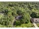 Stunning aerial view of a home nestled among mature trees, showcasing its private setting at 643 Princewood Dr, Deland, FL 32724