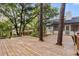 An expansive backyard wooden deck overlooks the home's landscaped outdoor living spaces at 643 Princewood Dr, Deland, FL 32724