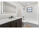 Modern bathroom with a sleek vanity, stylish fixtures, and a tiled shower-tub combo at 643 Princewood Dr, Deland, FL 32724