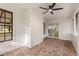 Relaxing screened in porch offers a ceiling fan and views of the backyard at 643 Princewood Dr, Deland, FL 32724