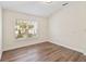 Inviting bedroom with hardwood floors, natural light and a peaceful view at 6484 S Goldenrod Rd # 41A, Orlando, FL 32822