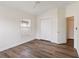 This bedroom offers wood floors, a window, and a neutral color scheme, perfect for relaxation at 6484 S Goldenrod Rd # 41A, Orlando, FL 32822