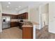 Modern kitchen with stainless steel appliances and ample counter space, leading to the living room at 6484 S Goldenrod Rd # 41A, Orlando, FL 32822