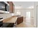 Bright kitchen offering stainless steel appliances and a view of the open-concept living area at 6484 S Goldenrod Rd # 41A, Orlando, FL 32822