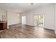 Spacious living room with hardwood floors and sliding glass doors that let in natural light at 6484 S Goldenrod Rd # 41A, Orlando, FL 32822