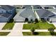 Bird's-eye view of a well-maintained home with green lawn in a friendly neighborhood at 7 Polermo Ave, St Cloud, FL 34771