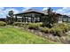 Community clubhouse featuring beautiful landscaping and outdoor recreational amenities at 7 Polermo Ave, St Cloud, FL 34771