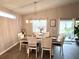 Elegant dining area featuring a stylish table, chairs, and natural light from a nearby window at 7 Polermo Ave, St Cloud, FL 34771
