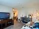 Comfortable living room featuring an electric fireplace and bright, open layout at 7 Polermo Ave, St Cloud, FL 34771