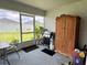 View of a patio with a grill, cabinet, and view of the yard at 7 Polermo Ave, St Cloud, FL 34771