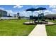 Community playground with green and blue slide and sunshades at 7 Polermo Ave, St Cloud, FL 34771