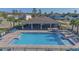Aerial view of a community pool with ample seating and a covered picnic area at 7 Polermo Ave, St Cloud, FL 34771