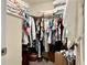 Spacious walk-in closet with ample hanging space, shelving, and convenient access to storage at 7 Polermo Ave, St Cloud, FL 34771
