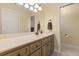 Neutral bathroom with a large vanity, granite countertops, and ample storage at 708 Valencia Ct, Winter Garden, FL 34787