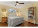 Bedroom featuring hardwood floors, soft lighting, and a bookshelf at 708 Valencia Ct, Winter Garden, FL 34787
