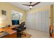 Bedroom features wood floors, closet and desk space at 708 Valencia Ct, Winter Garden, FL 34787