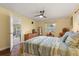 Comfortable bedroom with hardwood floors and easy access to a screened patio at 708 Valencia Ct, Winter Garden, FL 34787