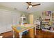 Craft room with hardwood floors, good lighting, work table and closet at 708 Valencia Ct, Winter Garden, FL 34787