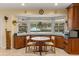 Kitchen with ample cabinet space and a cozy breakfast nook overlooking the pool at 708 Valencia Ct, Winter Garden, FL 34787