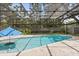 Private backyard pool with screened enclosure, shed, and patio area for entertaining at 708 Valencia Ct, Winter Garden, FL 34787