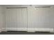 Interior with two sets of white bi-fold doors, perfect for storage or closets at 739 Parrot Ct, Poinciana, FL 34759