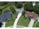 Sprawling aerial view of the house showing the well-manicured lawn, mature trees and neighborhood at 759 Lake Como Dr, Lake Mary, FL 32746