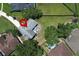 Aerial view of the home's backyard showing a lovely patio with furniture and a generous lawn area at 759 Lake Como Dr, Lake Mary, FL 32746
