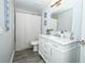 Bathroom featuring a vanity with white cabinets, framed mirror, and shower with tub at 759 Lake Como Dr, Lake Mary, FL 32746