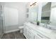 Elegant bathroom features a double sink vanity with marble countertop and updated fixtures at 759 Lake Como Dr, Lake Mary, FL 32746