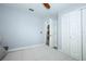 Bedroom features include a ceiling fan, ample closet space, and neutral decor at 759 Lake Como Dr, Lake Mary, FL 32746