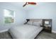 Cozy bedroom featuring a neutral color palette and a large window for natural light at 759 Lake Como Dr, Lake Mary, FL 32746