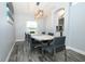 Bright dining room with modern lighting and wood-look flooring, great for gatherings at 759 Lake Como Dr, Lake Mary, FL 32746