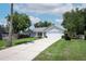 Charming single-story home with a two-car garage and a well-maintained front yard at 759 Lake Como Dr, Lake Mary, FL 32746