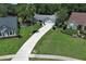 Charming single-story home boasts a lush lawn, palm tree, and long driveway to the attached two-car garage at 759 Lake Como Dr, Lake Mary, FL 32746